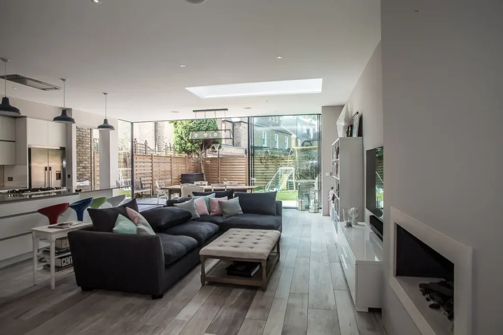 Spacious open-plan interior of a Chiswick house extension after renovation, featuring modern design and natural light