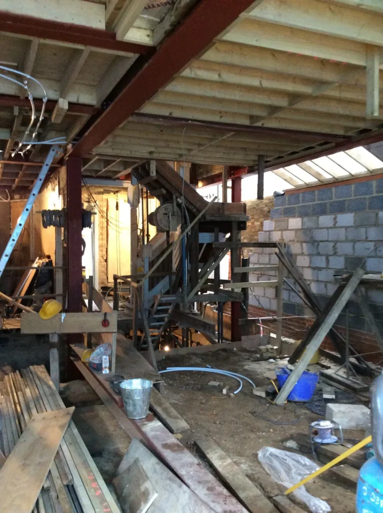 Steel beams installed to support an open-plan house extension in West London